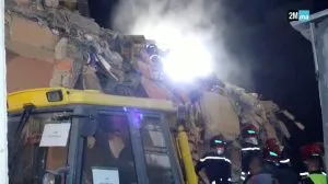 Civil protection members search for survivors near rubble, following an earthquake, in Chichaoua