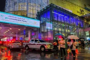 People flee following shots fired at the luxury Siam Paragon shopping mall, in Bangkok