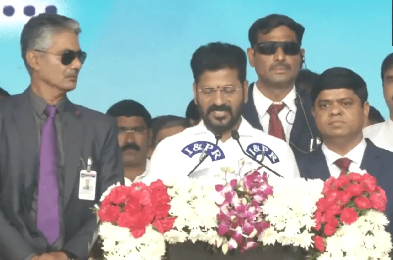 Congress leader Revanth Reddy takes oath as the Chief Minister of Telangana at Hyderabad's LB stadium