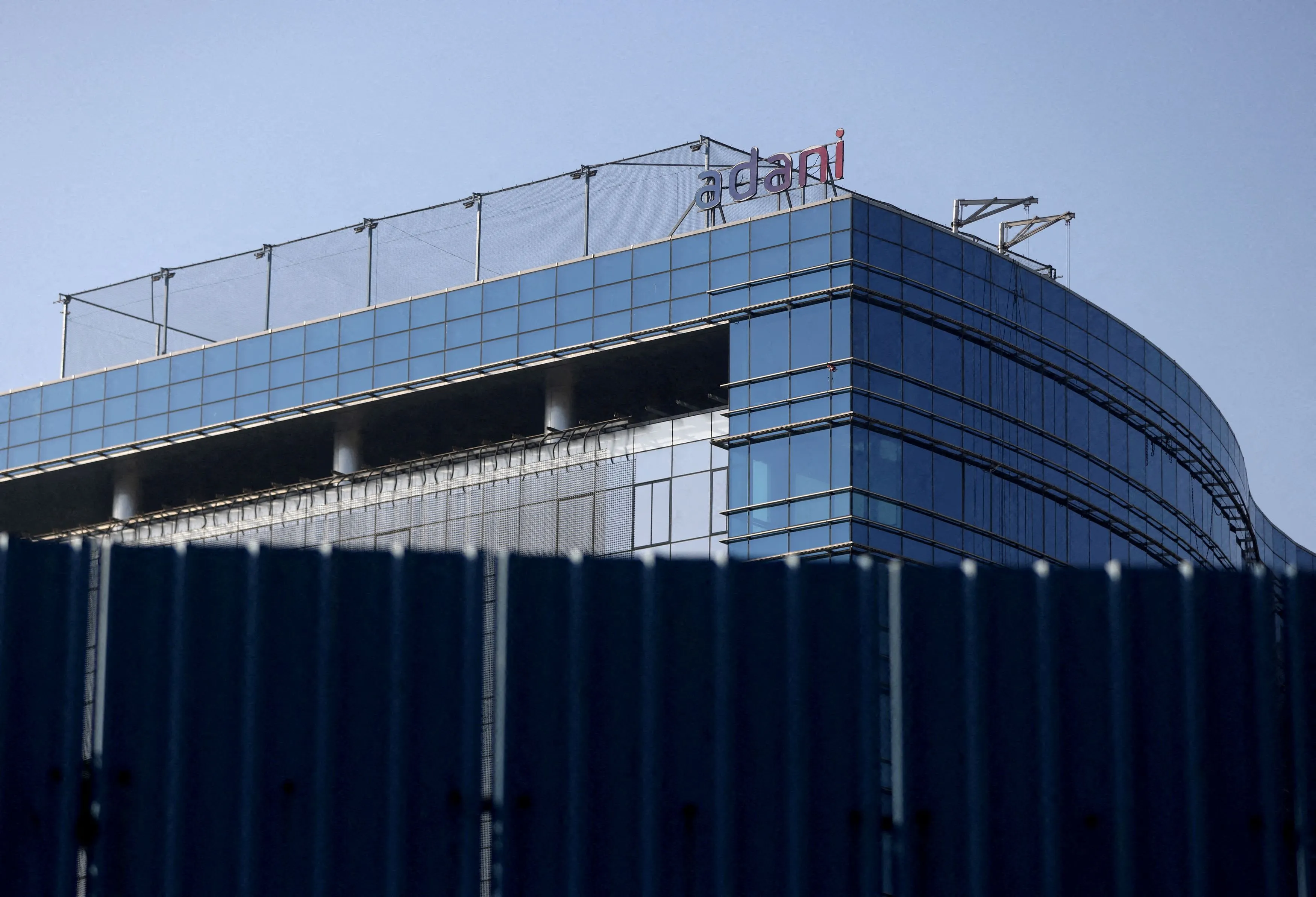 FILE PHOTO: FILE PHOTO: FILE PHOTO: A logo of the Adani Group is seen on a commercial complex in Mumbai