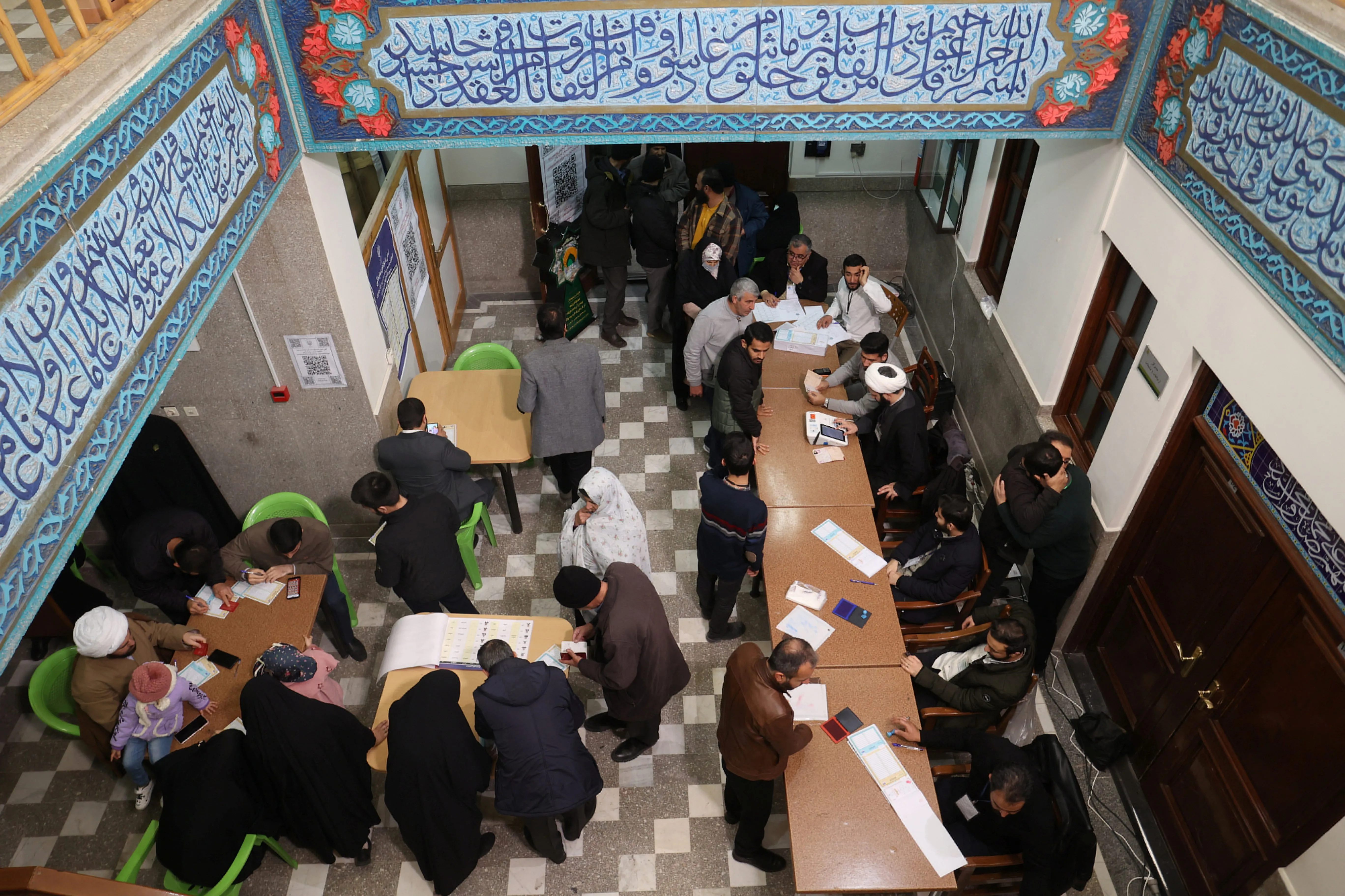 Iranians vote during parliamentary elections at a polling station in Tehran