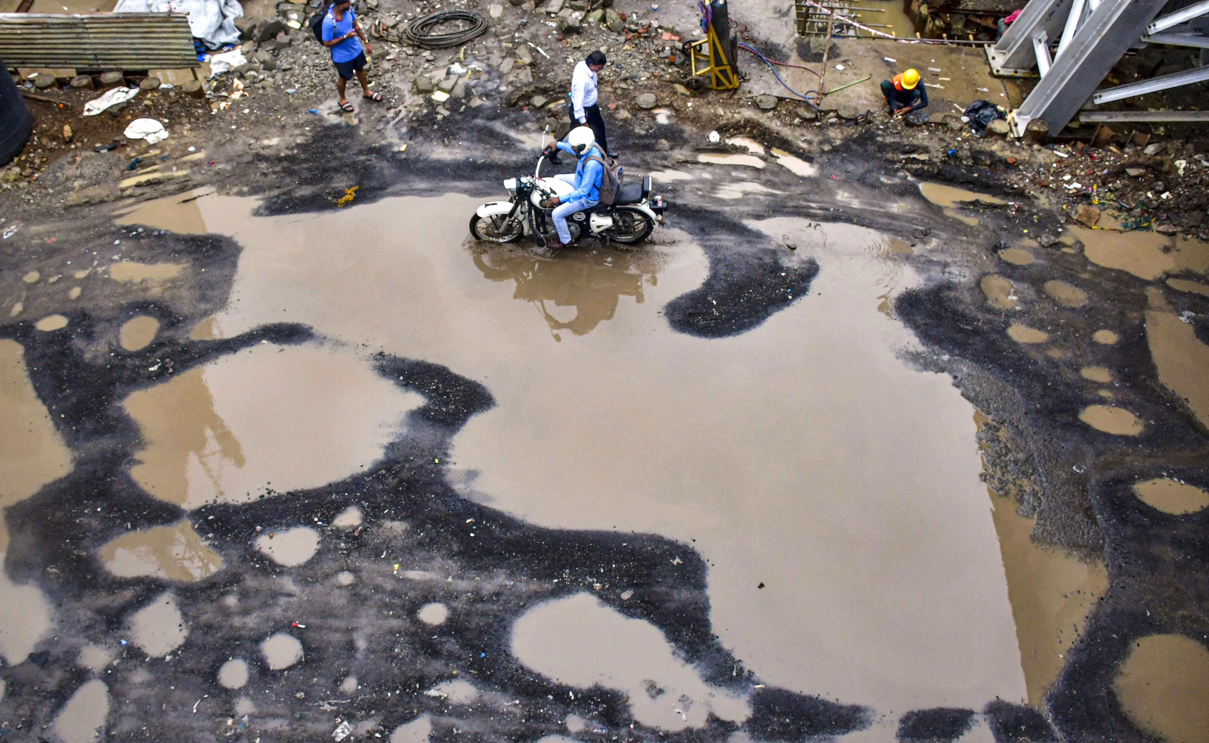 Rain damages road in Mumbai