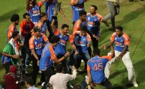 Indian team cricketers dance during a victory lap to celebrate winning the ICC Men's T20 World Cup, at Wankhede stadium in Mumbai,