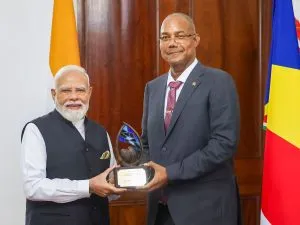 PM Modi and Patrick Herminie