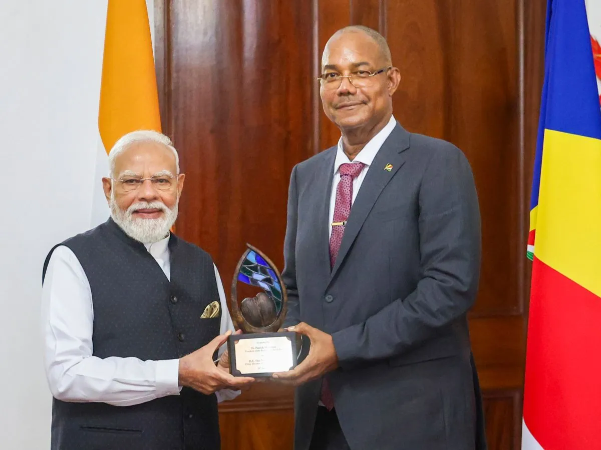 PM Modi and Patrick Herminie